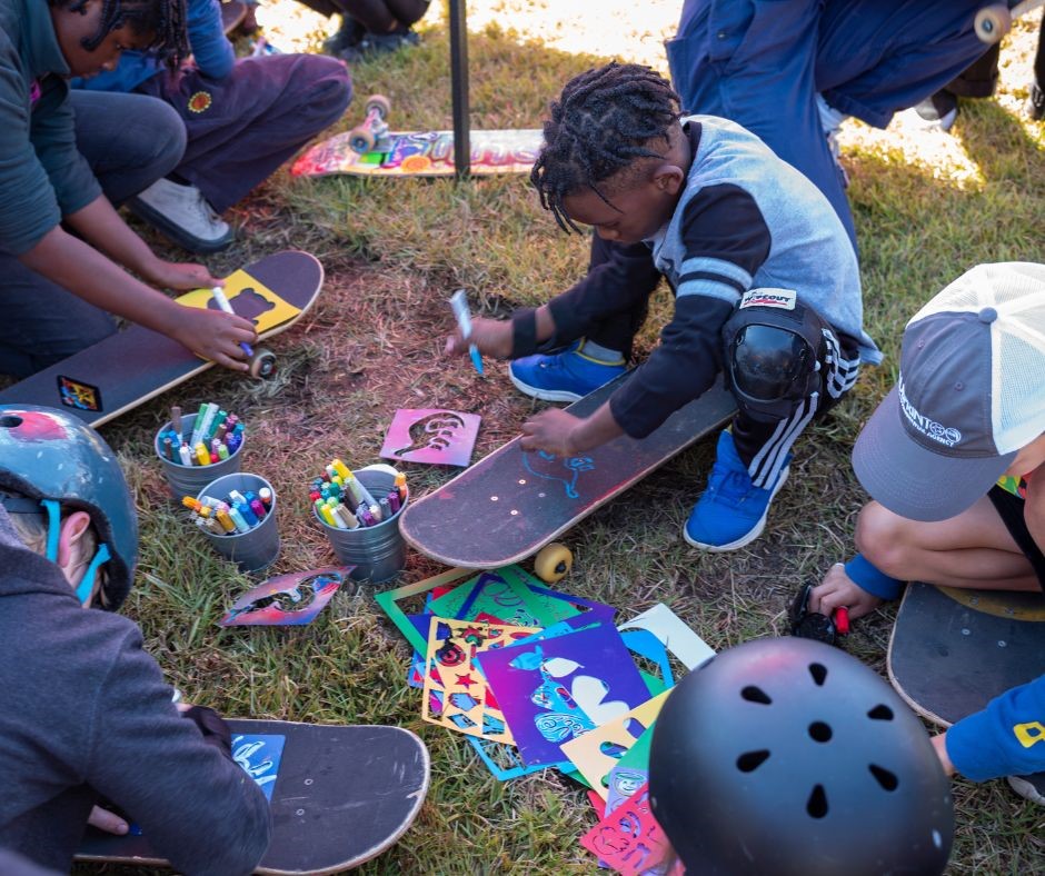 skateboards are being decorated by young children